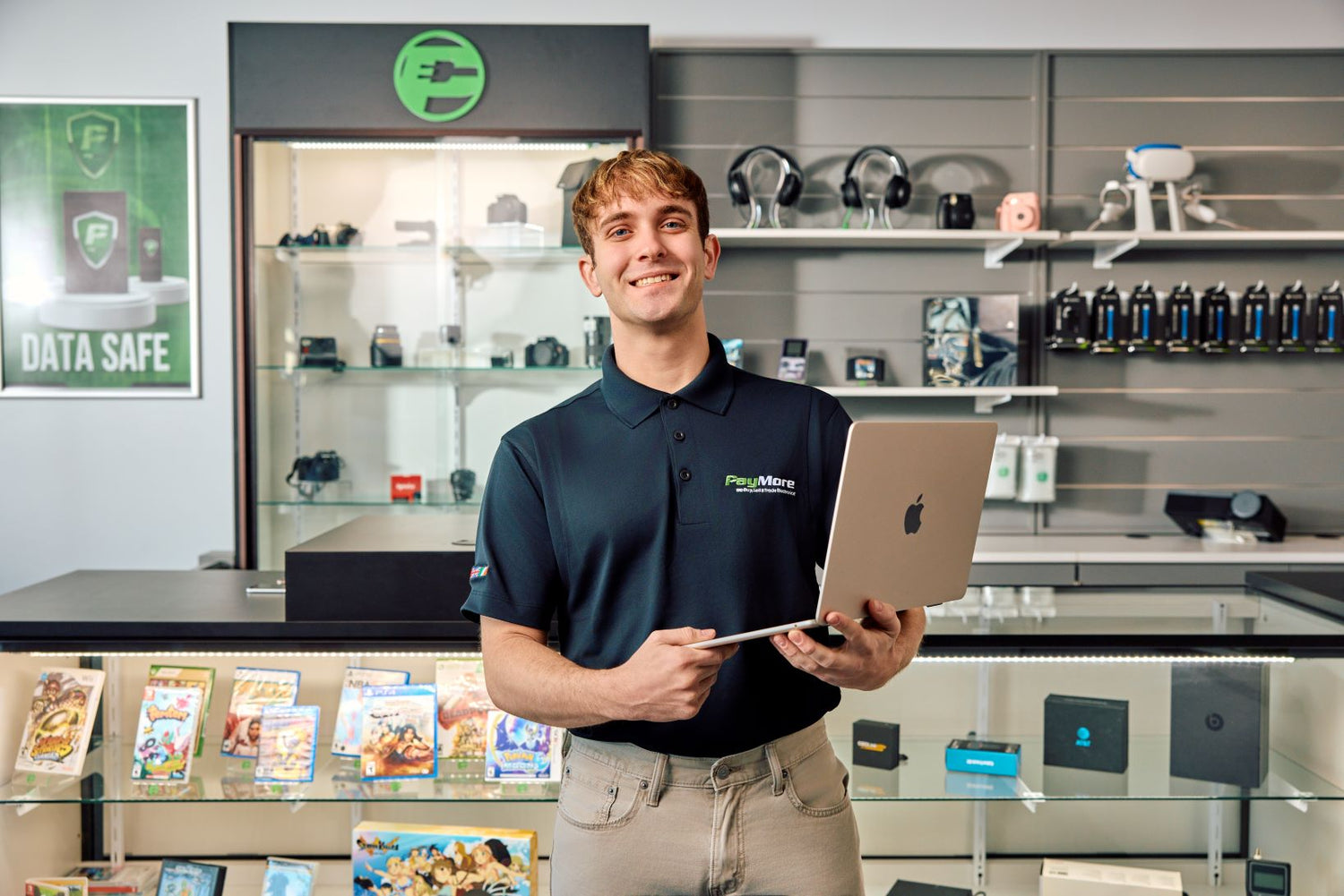 employee holding a laptop